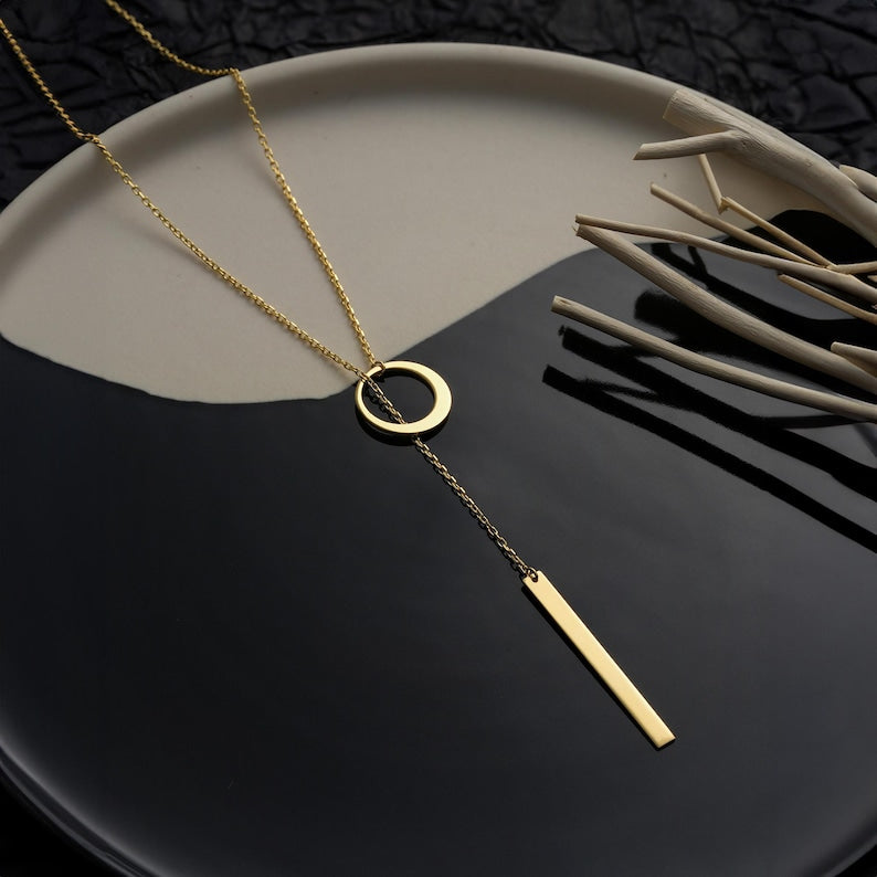 CIRCLE AND BAR LARIAT NECKLACE IN GOLD