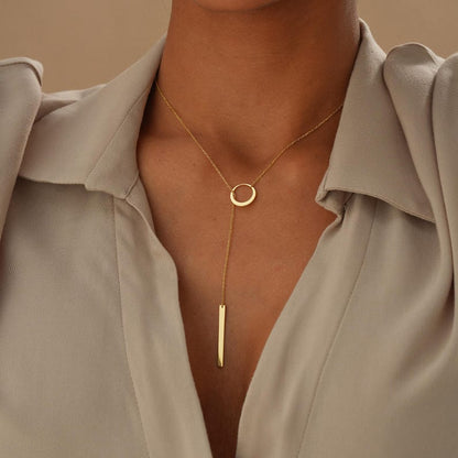 CIRCLE AND BAR LARIAT NECKLACE IN GOLD